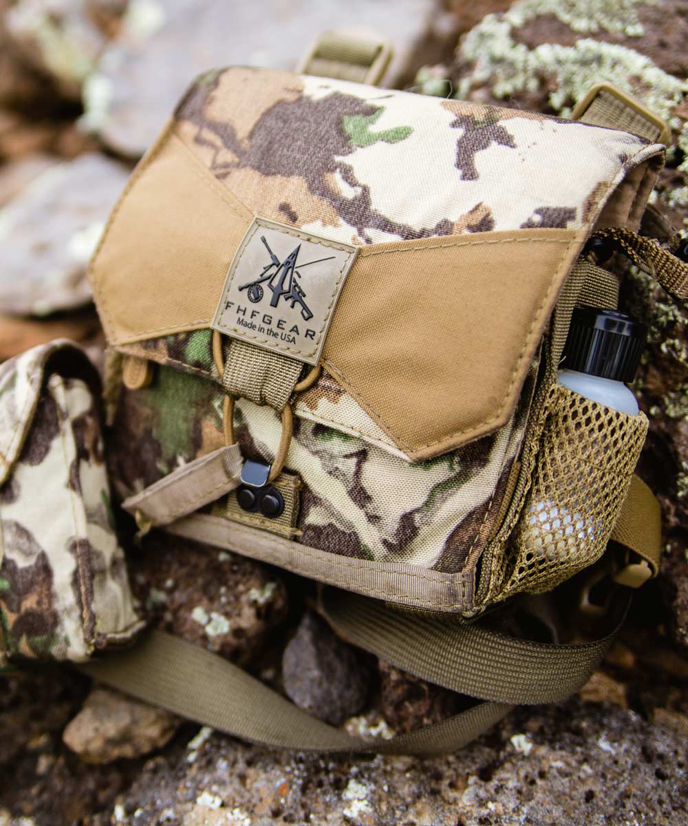 Multicam FHF GEAR binocular harness with tan accents, logo patch, and mesh side pocket.