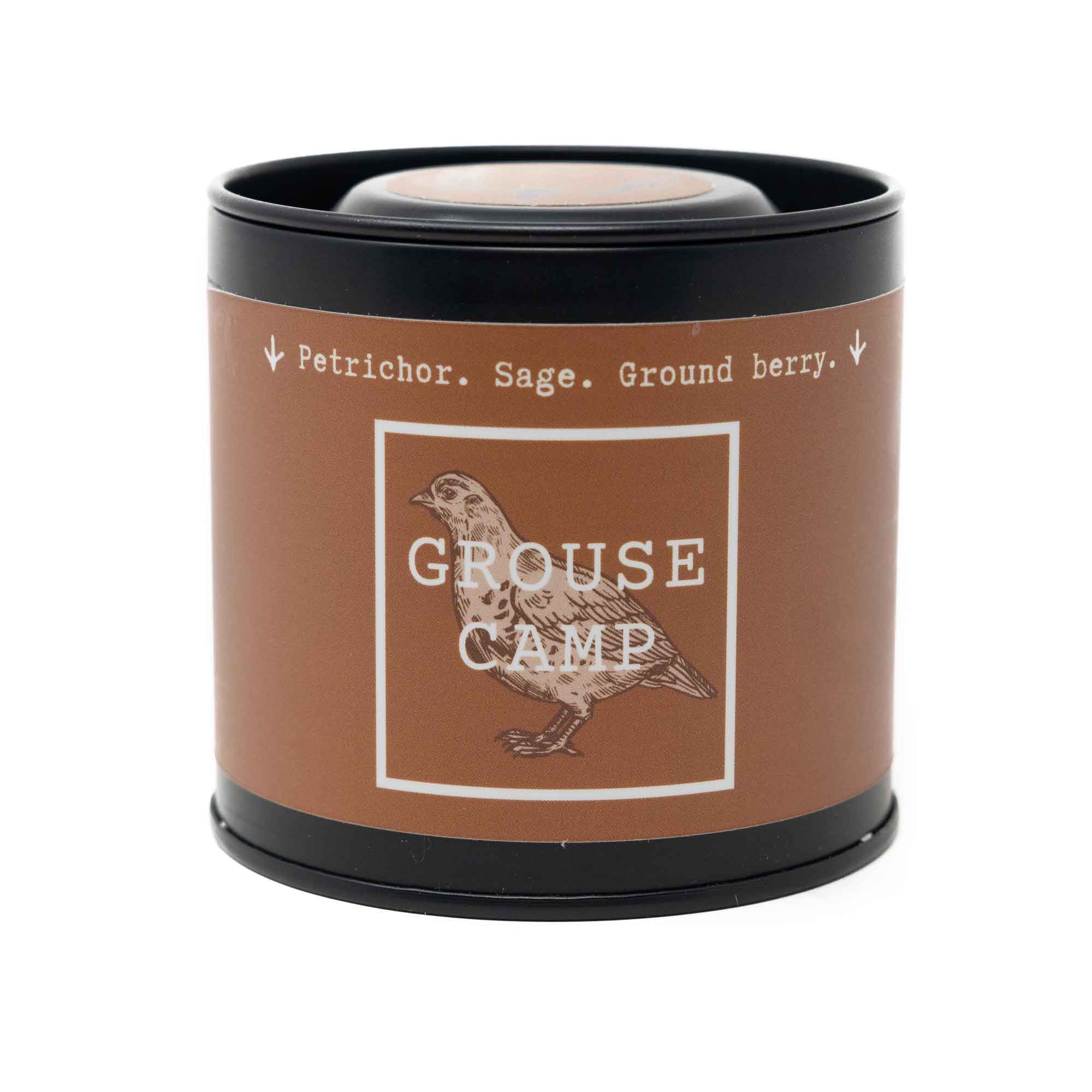 Grouse Camp petrichor, sage, and ground berry scented candle.