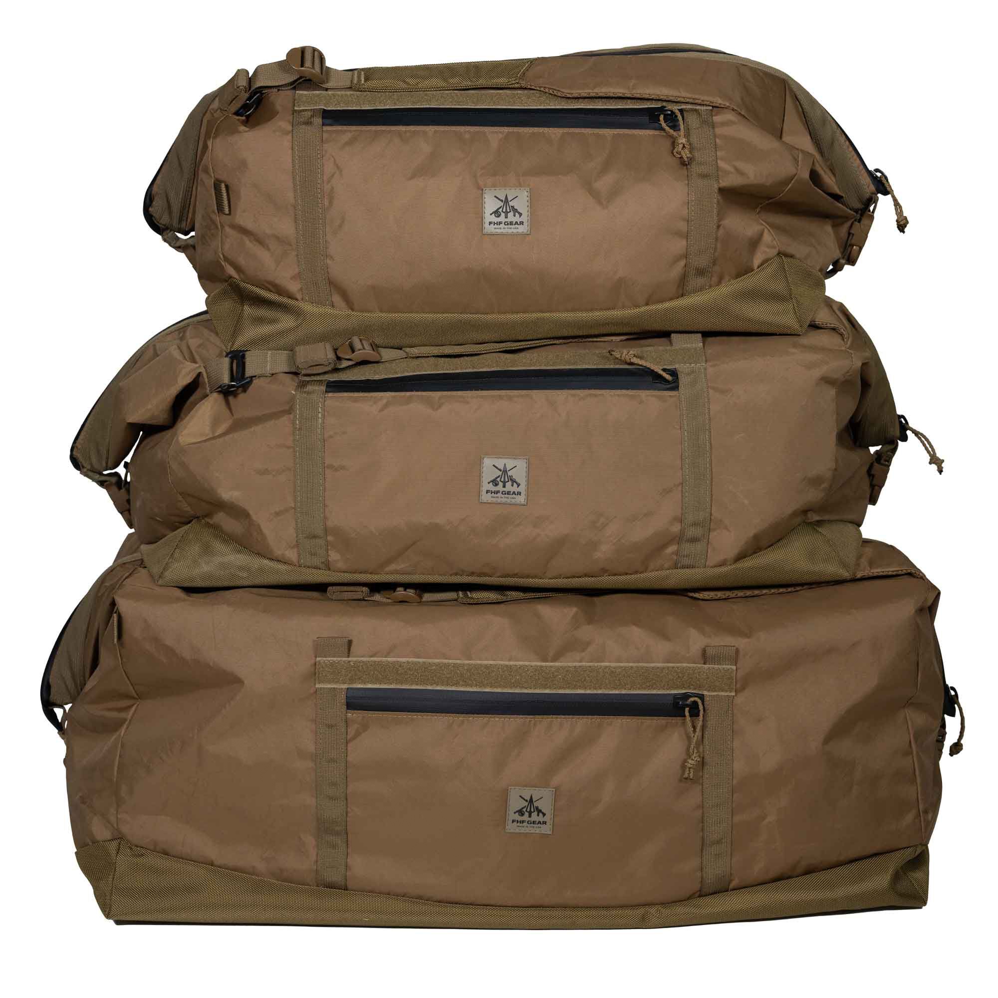 Stacked brown duffel bags, each with a zippered pocket and FHF GEAR patch.