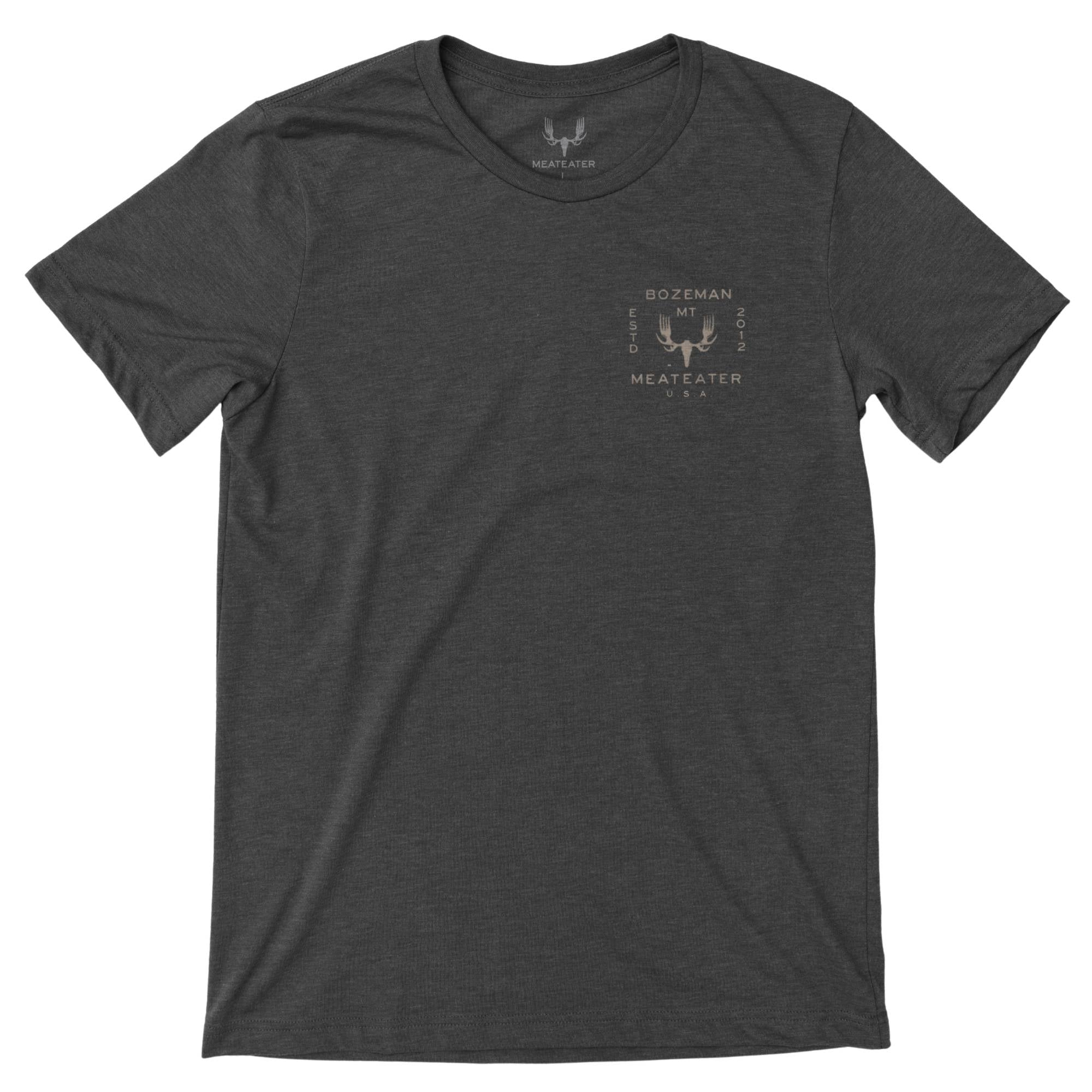 Charcoal heather t-shirt with a beige MeatEater fork-antler logo and text on left chest.