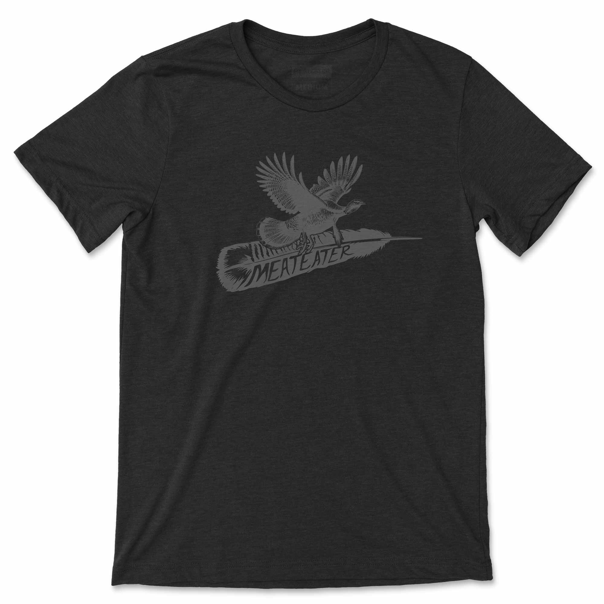 Dark gray t-shirt with a turkey flying above a feather and "MEATEATER" graphic.