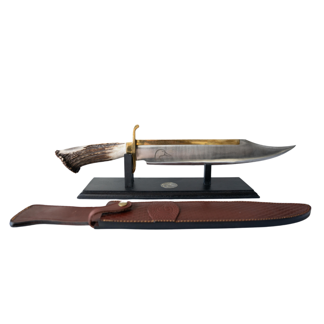Antler-handled bowie knife on stand with brown sheath; Ducks Unlimited logo on blade.