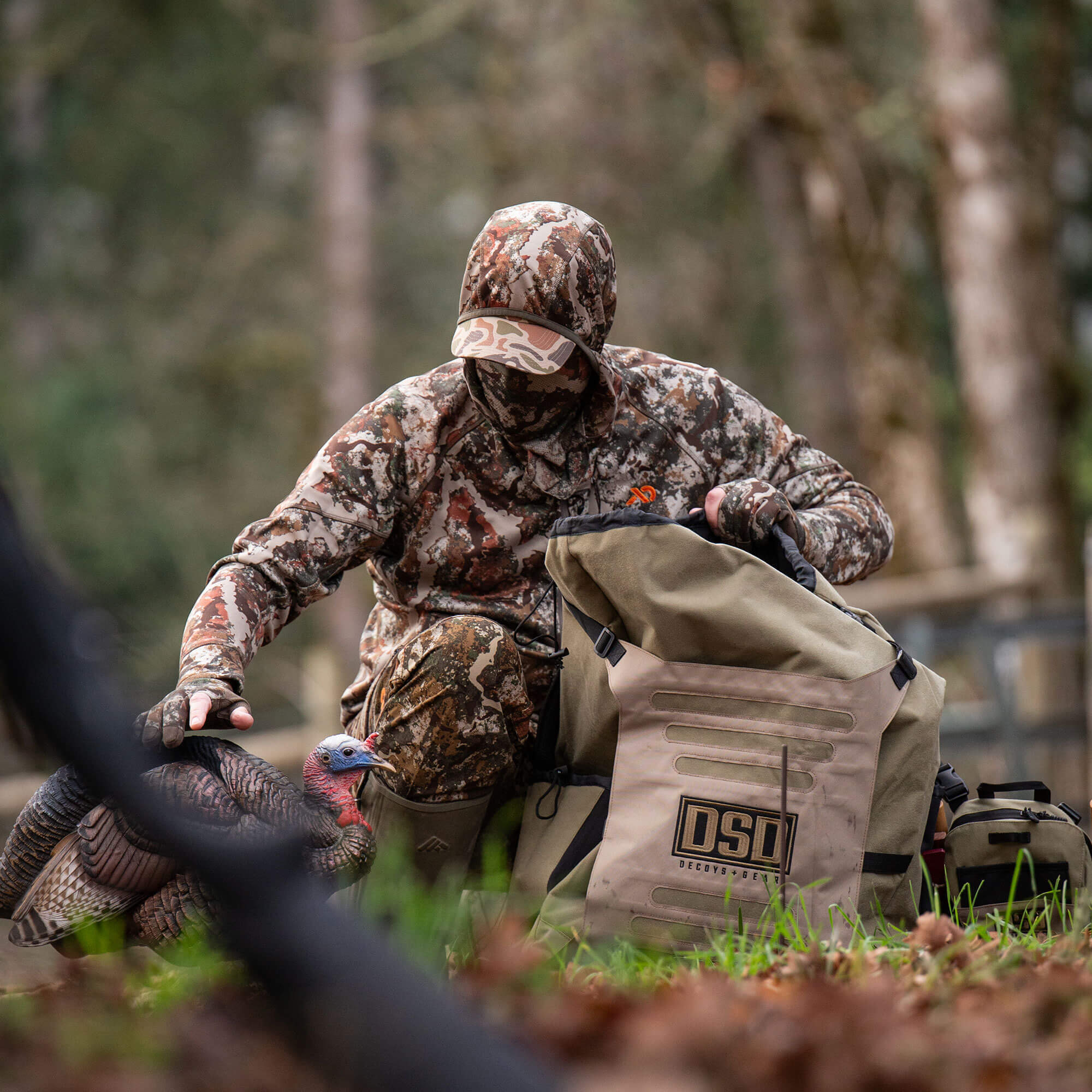 Tan DSD Decoy Bag and realistic turkey decoy with a camo hunter.