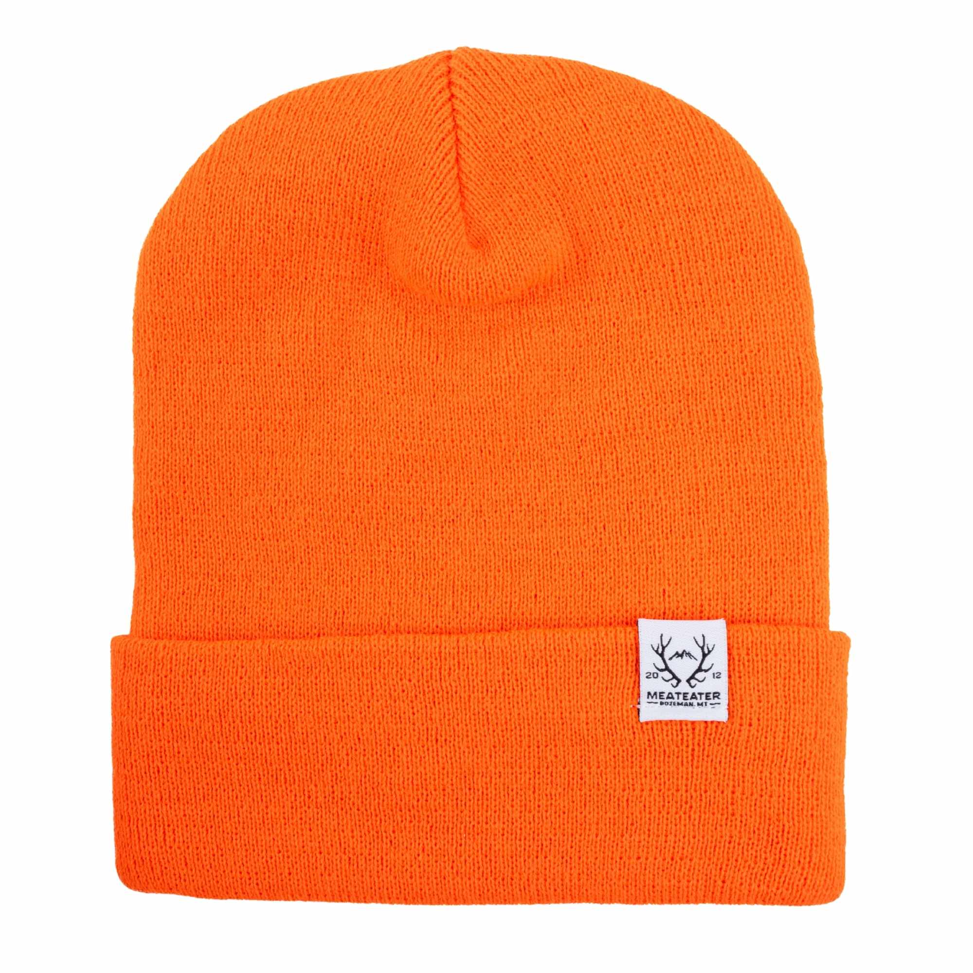 Orange beanie with white label depicting '2012 MEATEATER Bozeman, ME' and a pair of deer antlers.