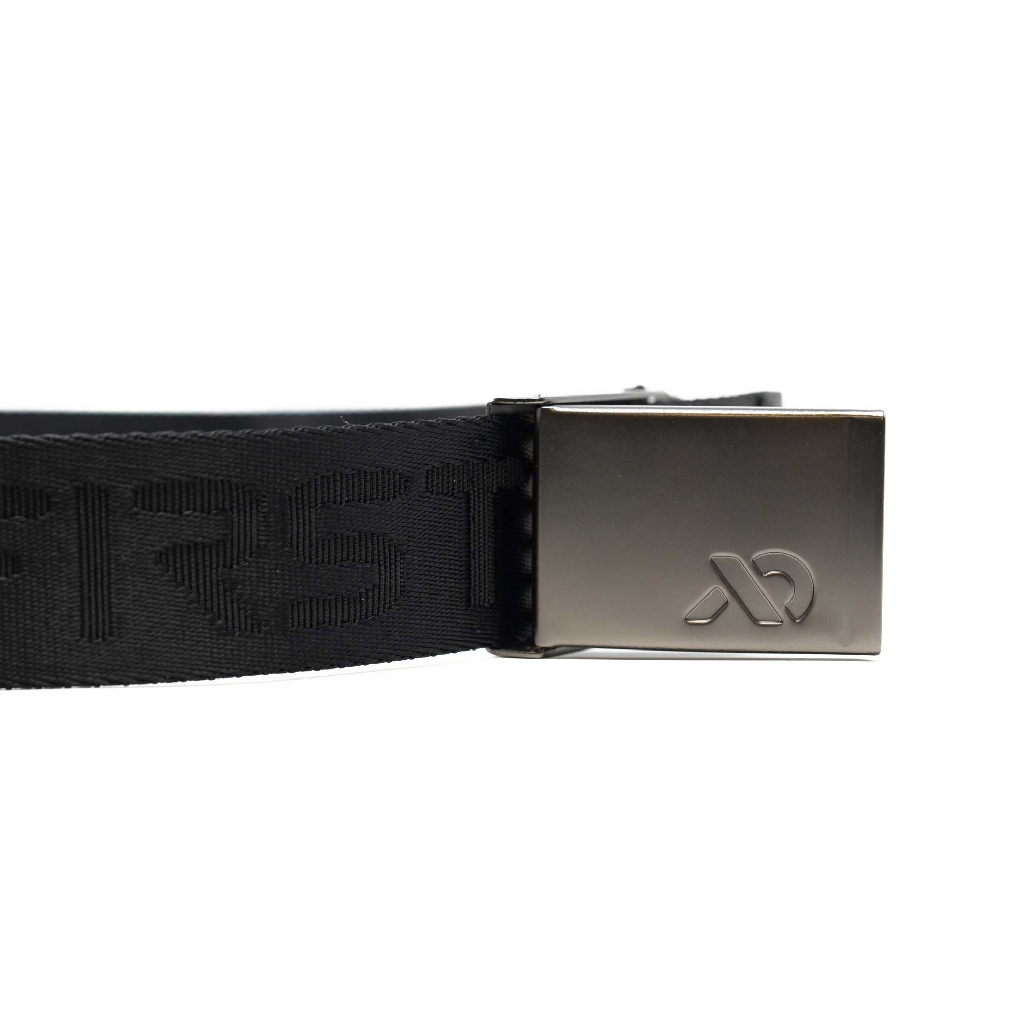 Close up of silver buckle with First Lite logo and a black belt.