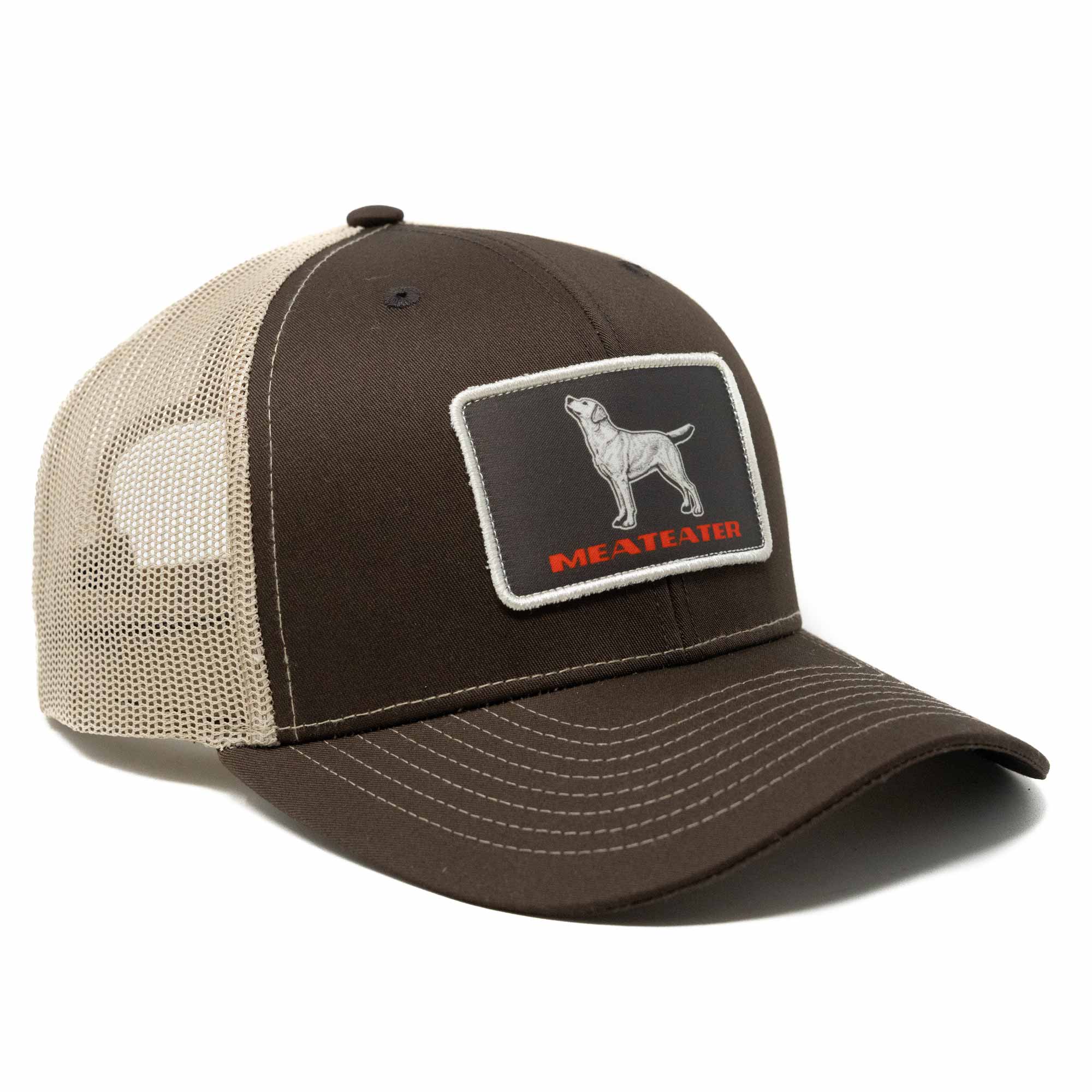 Brown and beige cap with a patch featuring a dog illustration and 'MEATHEAD' text on a white background.