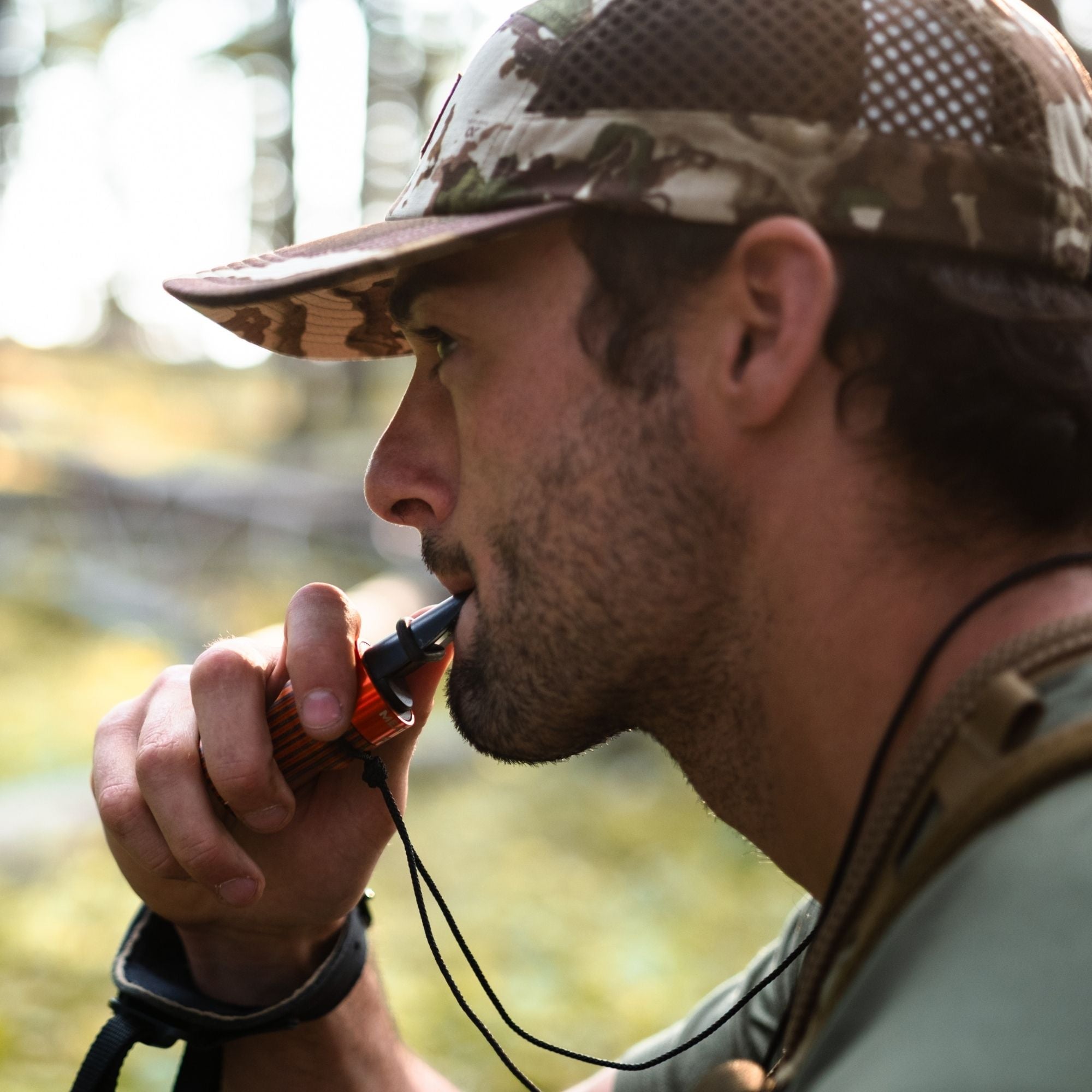Man using a MeatEater x Phelps E-Z Elk Call 