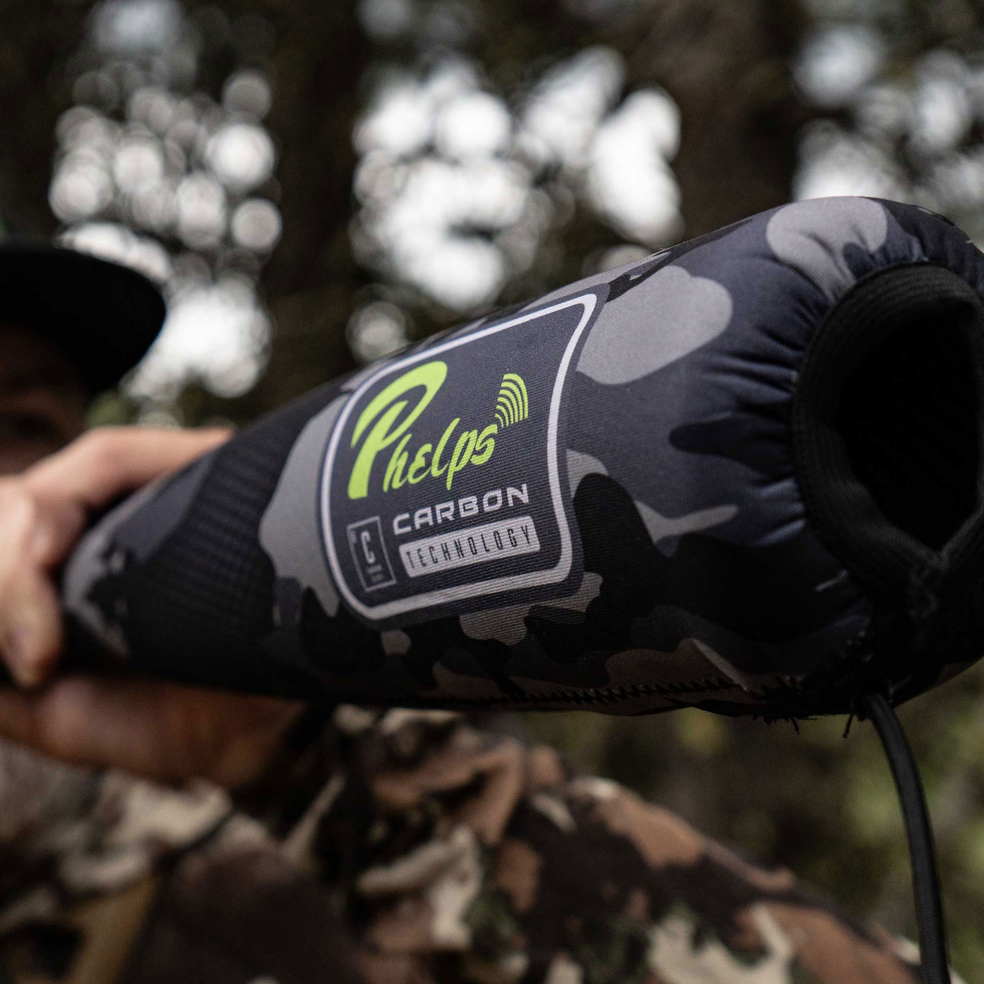 Grey camo Phelps Carbon Technology cylindrical sleeve with a black opening.