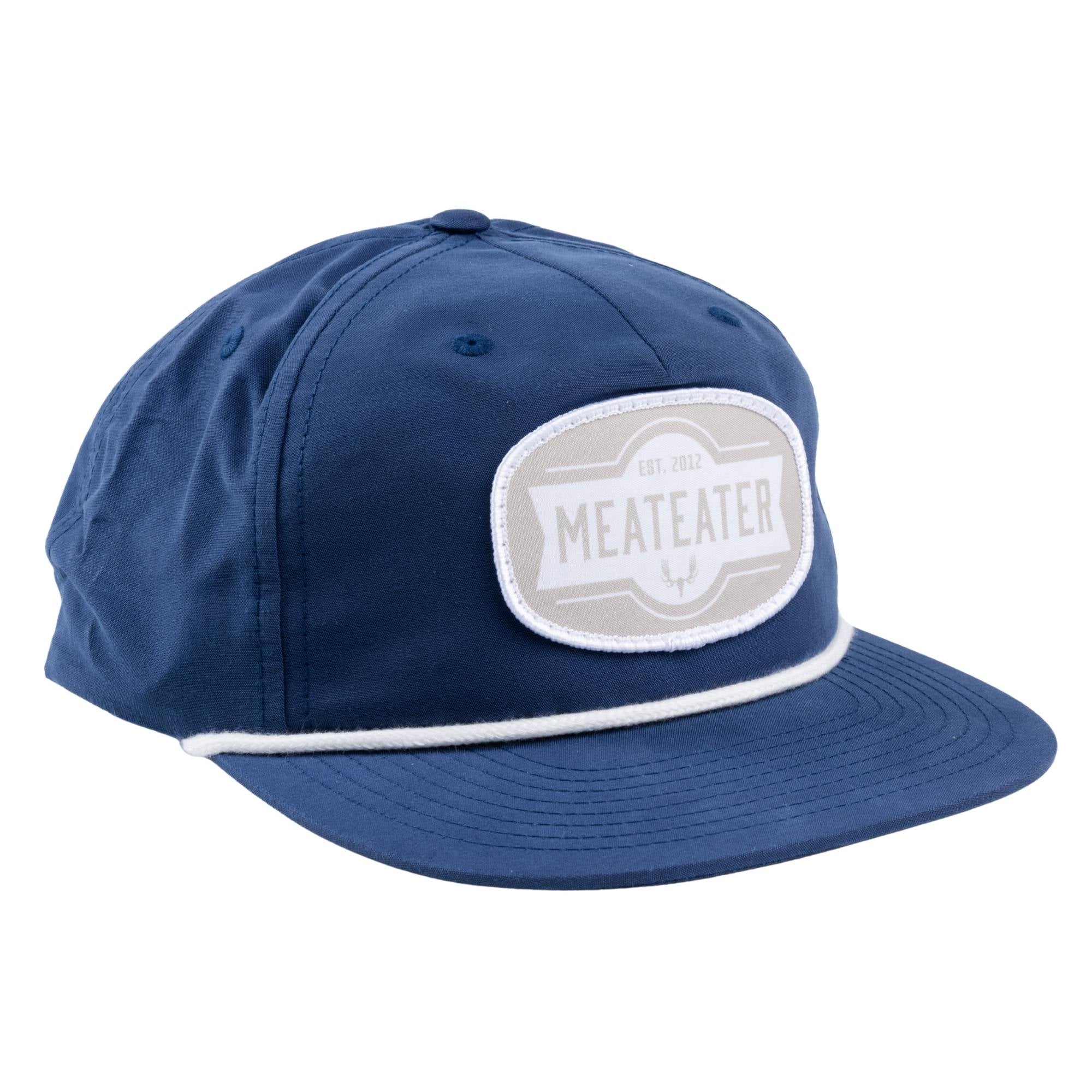 Navy and white cap with a patch featuring the text "Est. 2012 MEATEATER" on a white background.