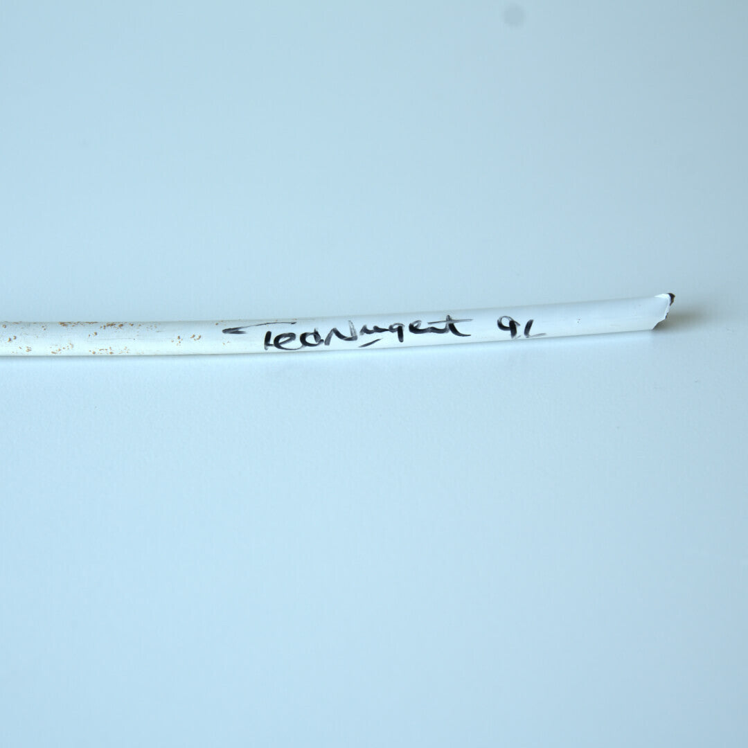 White arrow shaft"Ted Nugent 91" text, left side soiled, and right end broken.