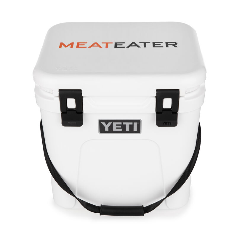 https://store.themeateater.com/dw/image/v2/BHHW_PRD/on/demandware.static/-/Sites-meateater-master/default/dwf8f21234/meateater-branded-yeti-roadie-24/meateater-branded-yeti-roadie-24_color_white_1.jpg?sw=800&sh=800